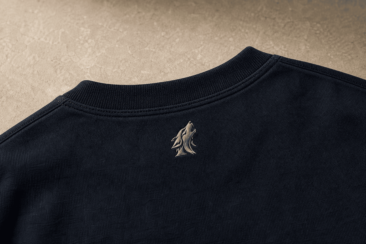 Close-up of the DYRWOLF T-Shirt in Navy back collar mark