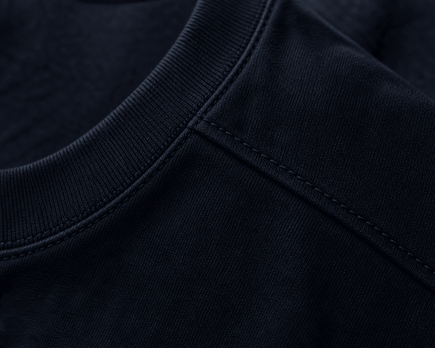 Macro detail of the DYRWOLF T-Shirt in Navy fabric