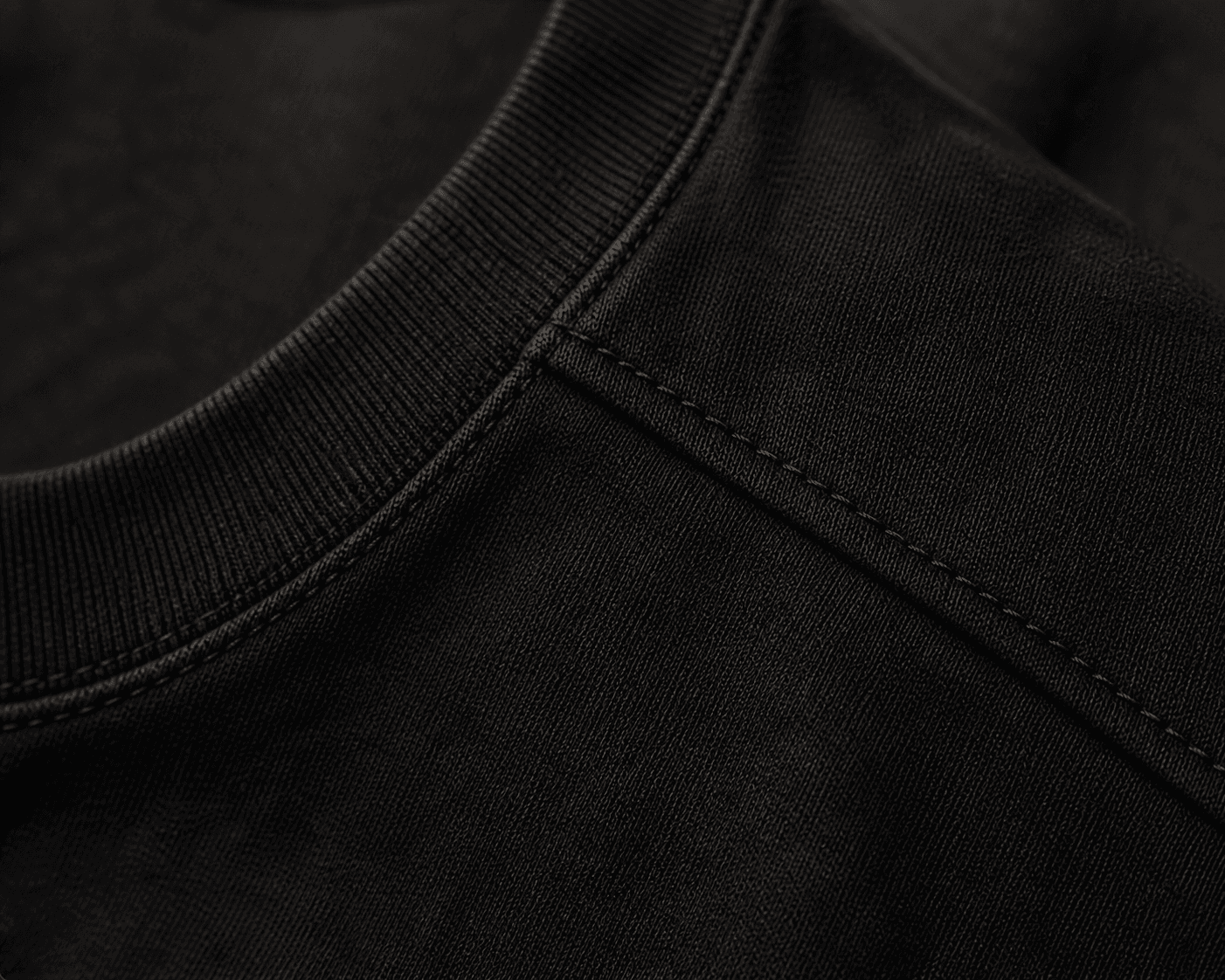 Macro detail of the DYRWOLF T-Shirt in Black fabric