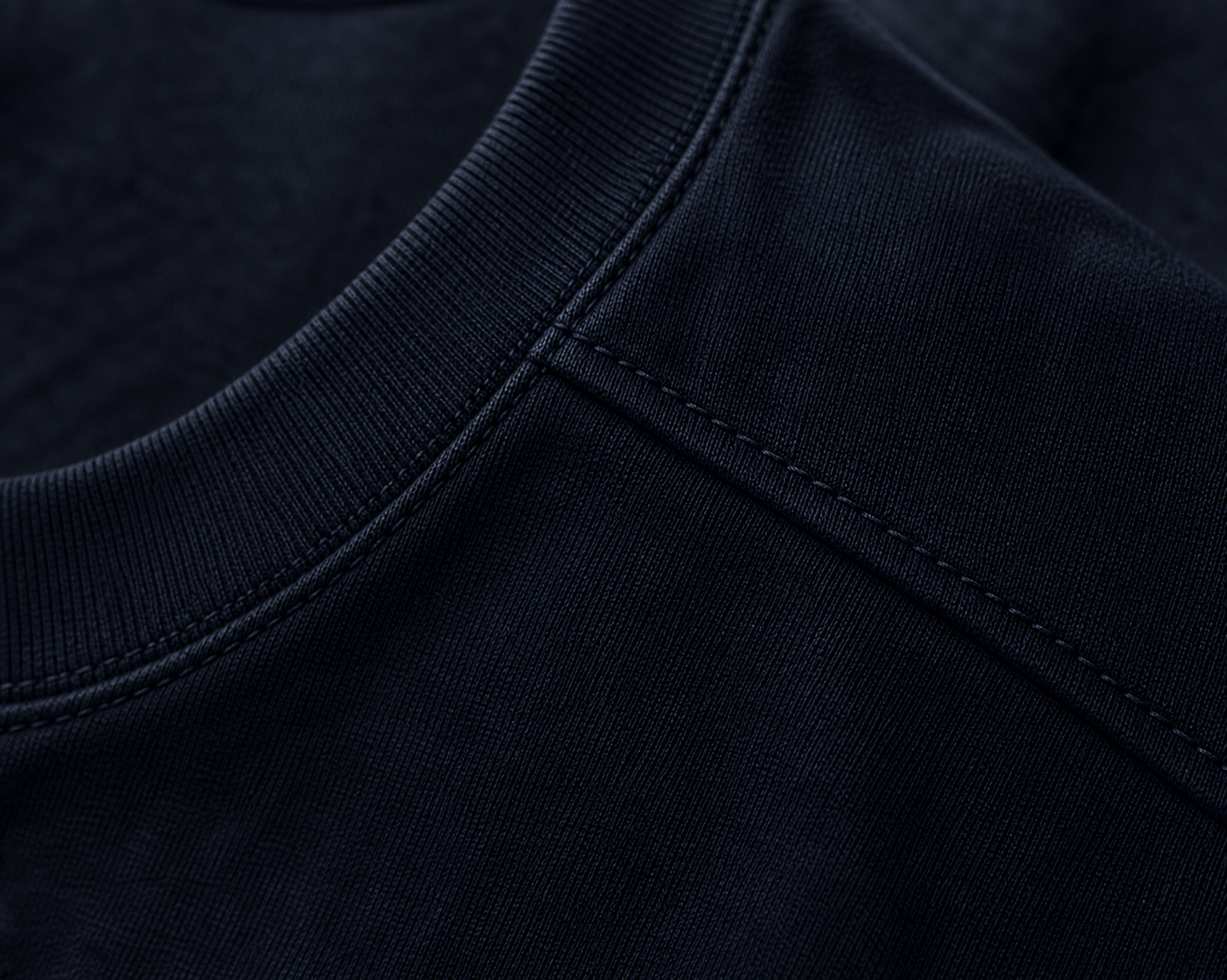 Macro detail of the DYRWOLF Navy T-Shirt fabric and stitching