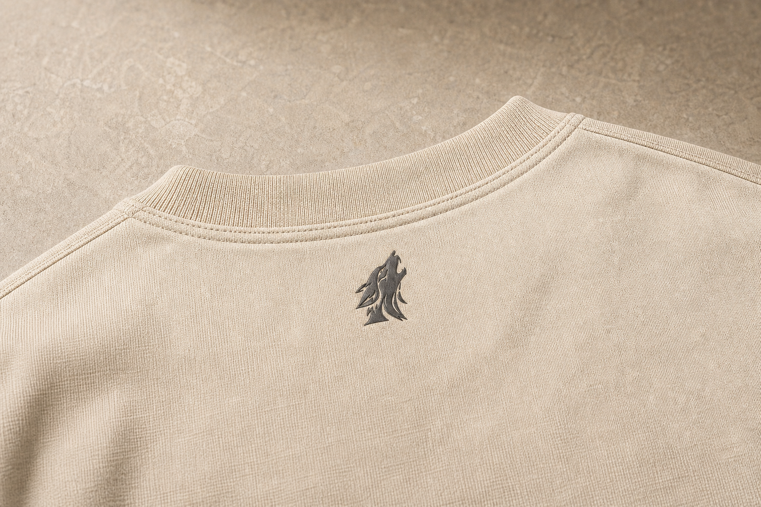 Close-up of the DYRWOLF Sand T-Shirt back collar mark