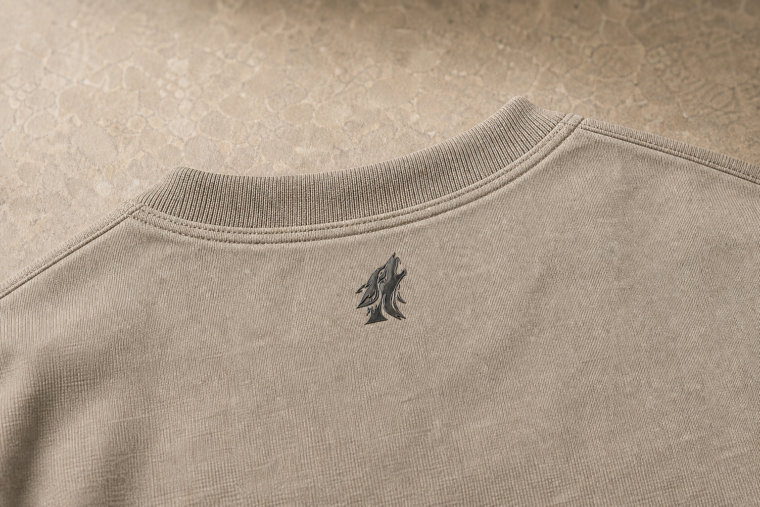 Close-up of the DYRWOLF Stone T-Shirt back collar mark