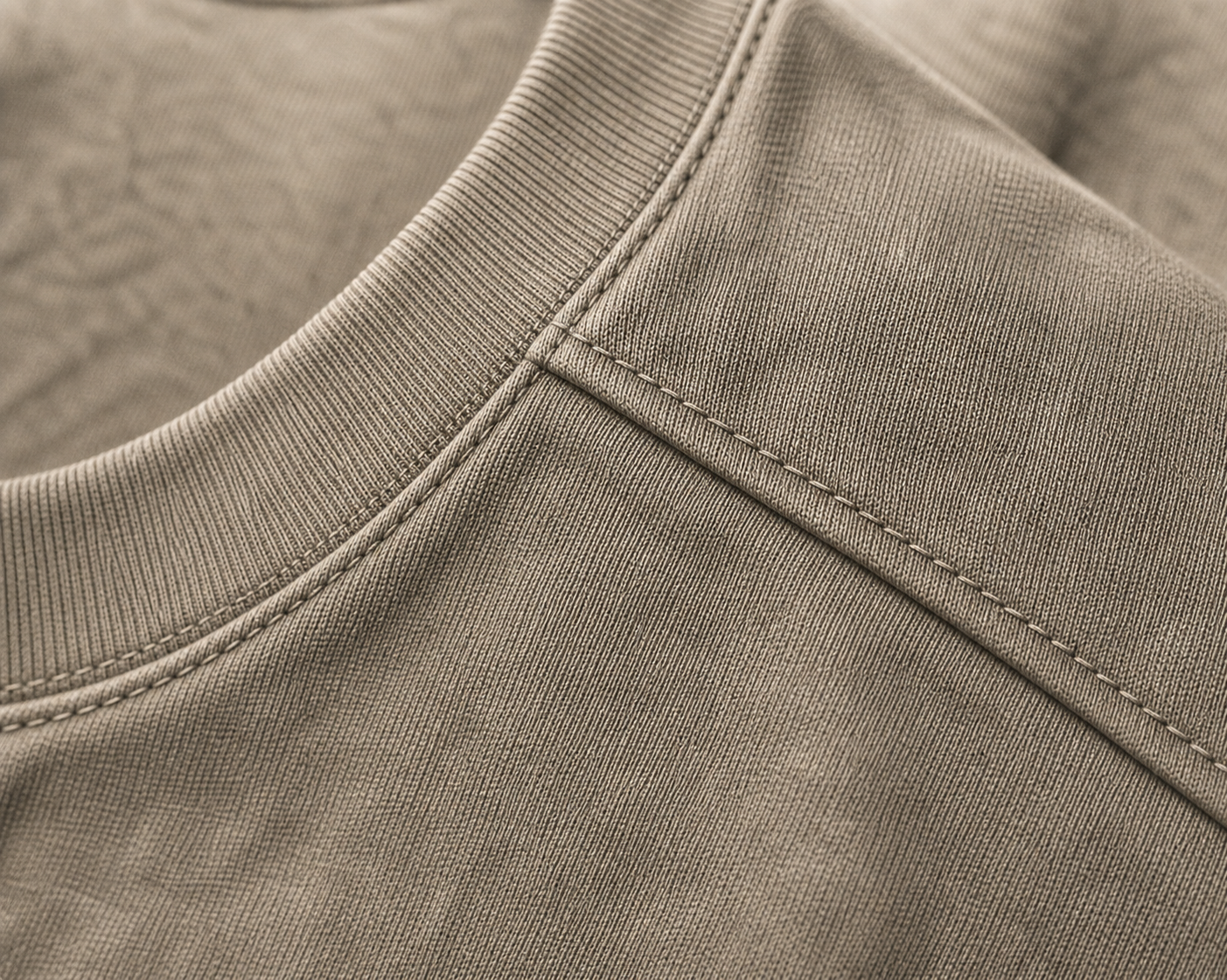 Macro detail of the DYRWOLF Stone T-Shirt fabric and stitching